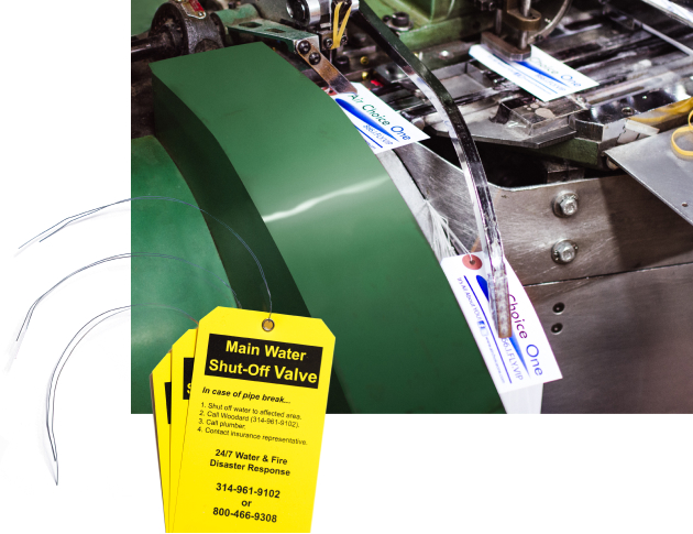 Stringing and wiring machine used to make vinyl tags with wire attachments