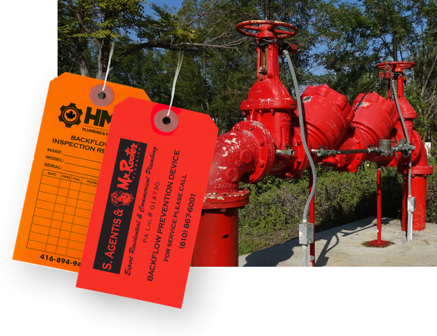custom printed vinyl backflow tags with a valve assembly in the background